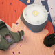 You can get several BlazePod accessories. Pictured here is an adaptor, a couple of suction cups, and a strap.